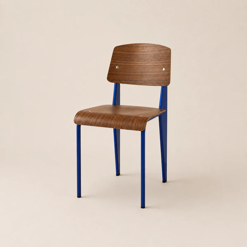Chair with wooden seat and backrest and blue metal legs on a beige background