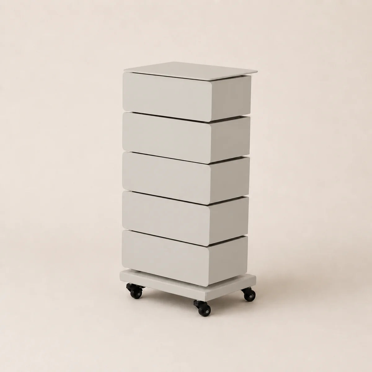 White rolling dresser with four drawers on a beige background