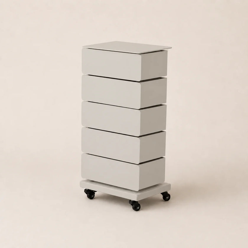 White rolling dresser with four drawers on a beige background