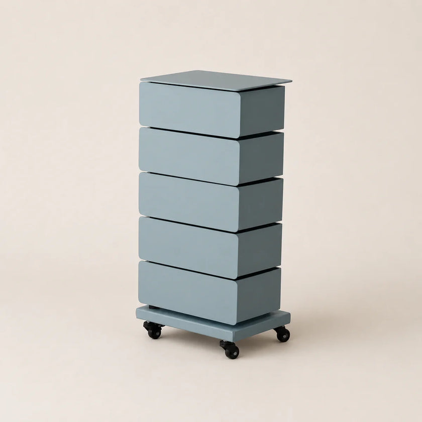 Blue cylindrical storage unit with five drawers on wheels against a beige background