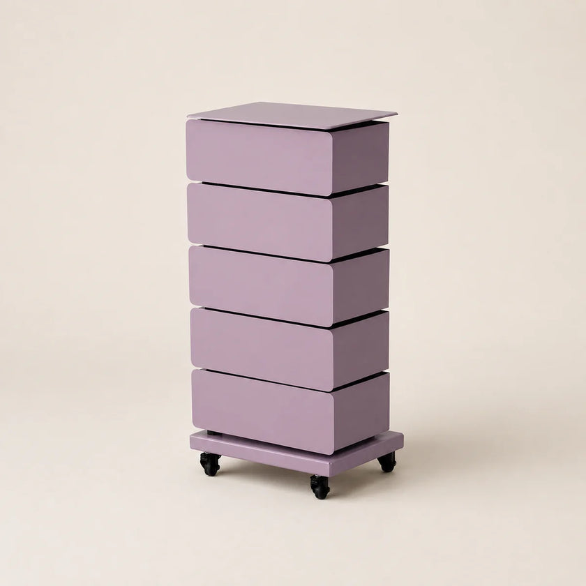 Purple drawer unit on wheels with four drawers against a beige background