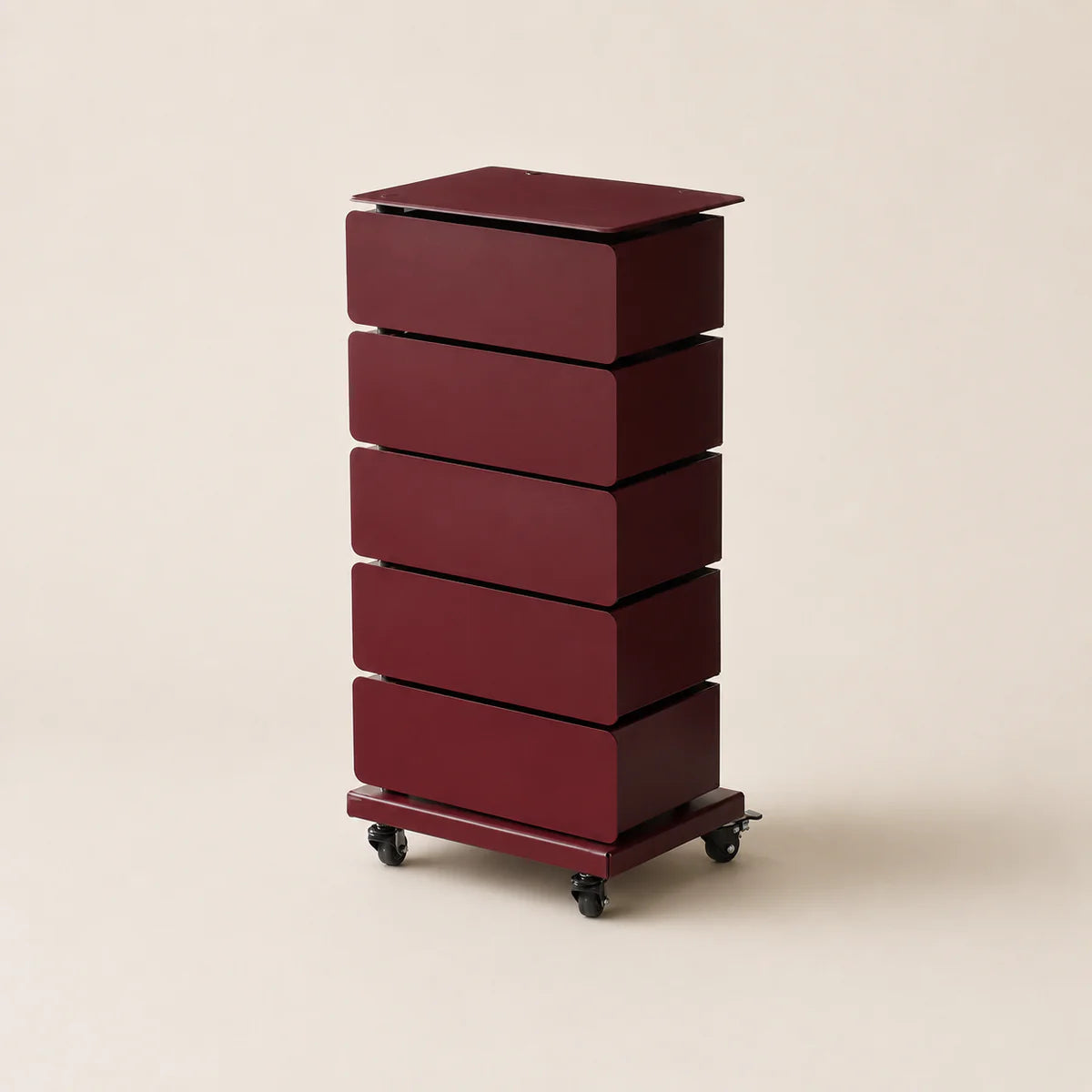 Red cylindrical storage unit with multiple drawers on a beige background