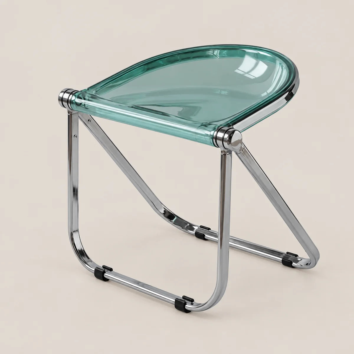 A modern folding stool with a translucent mint green glass seat and a polished chrome metal frame, shown on a solid light beige background.
