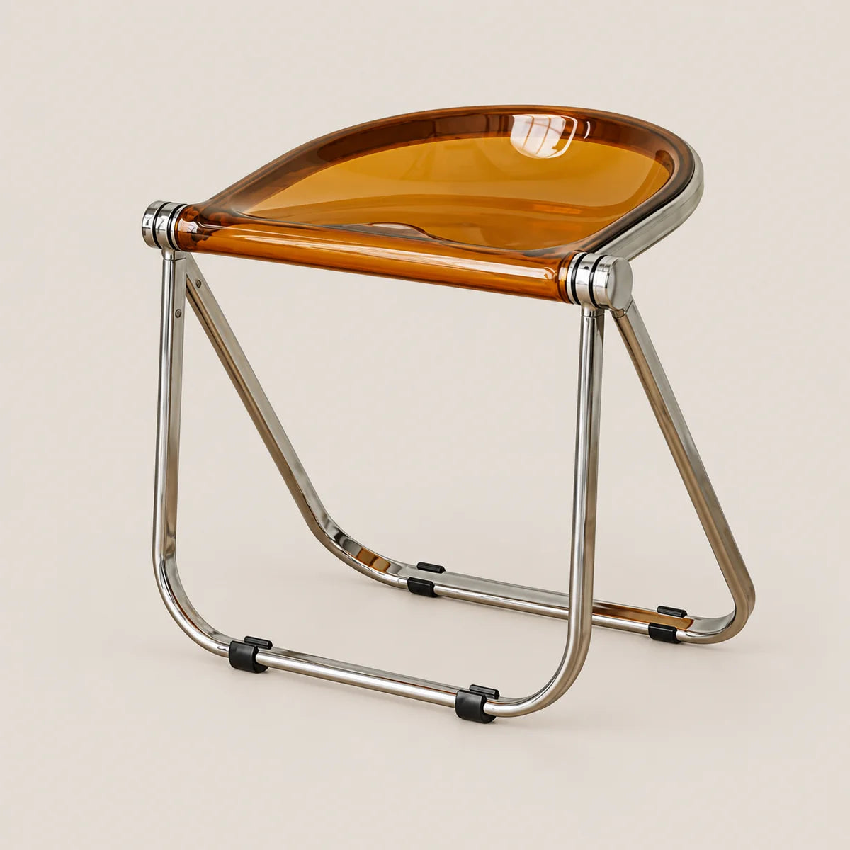 A modern folding stool with a translucent amber-brown seat and a polished chrome metal frame, shown on a solid light beige background.