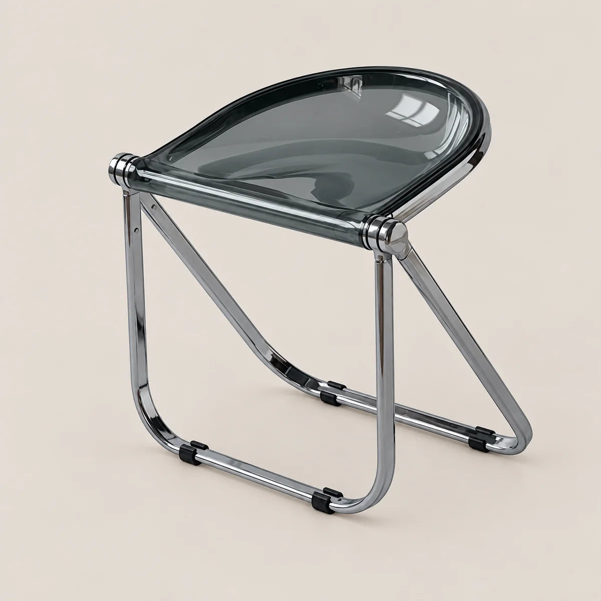 A modern folding stool with a translucent dark gray seat and a polished chrome metal frame, shown on a solid light beige background.