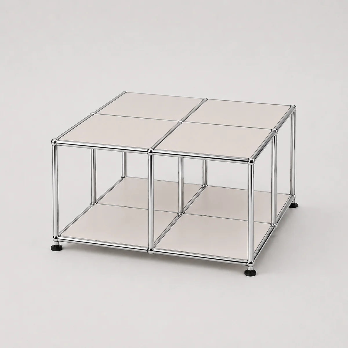 A modular storage cube organizer with a chrome silver metal frame, white metal panels, and black feet, shown on a light gray background.