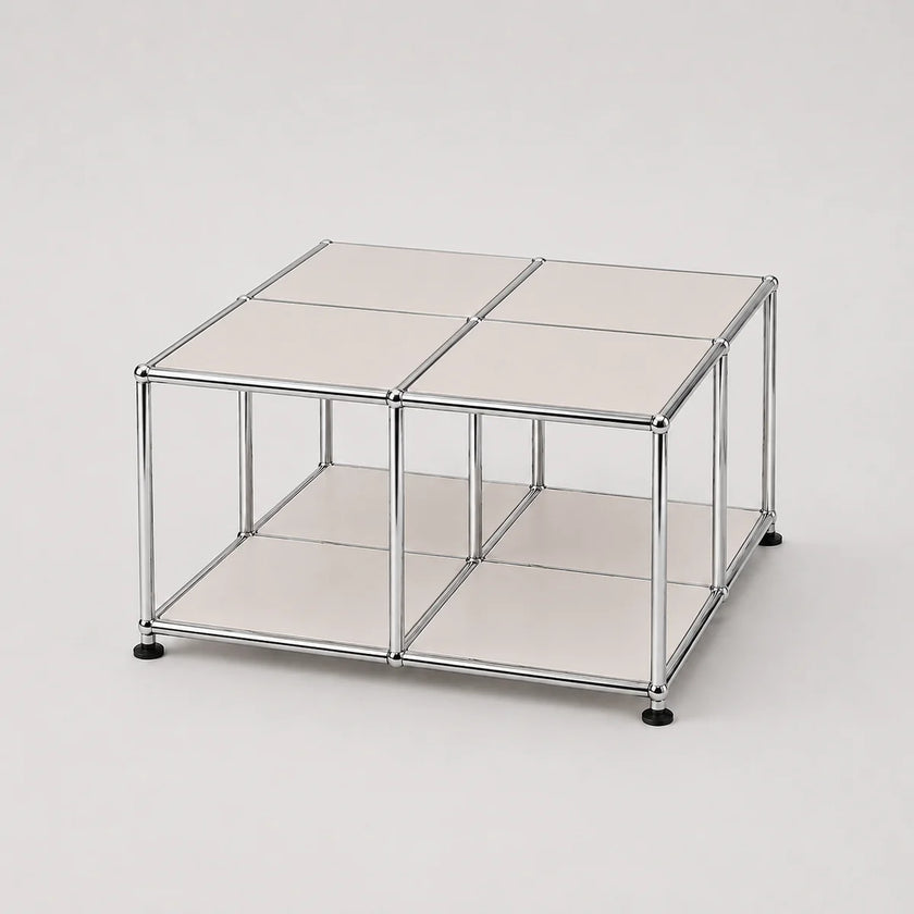 A modular storage cube organizer with a chrome silver metal frame, white metal panels, and black feet, shown on a light gray background.
