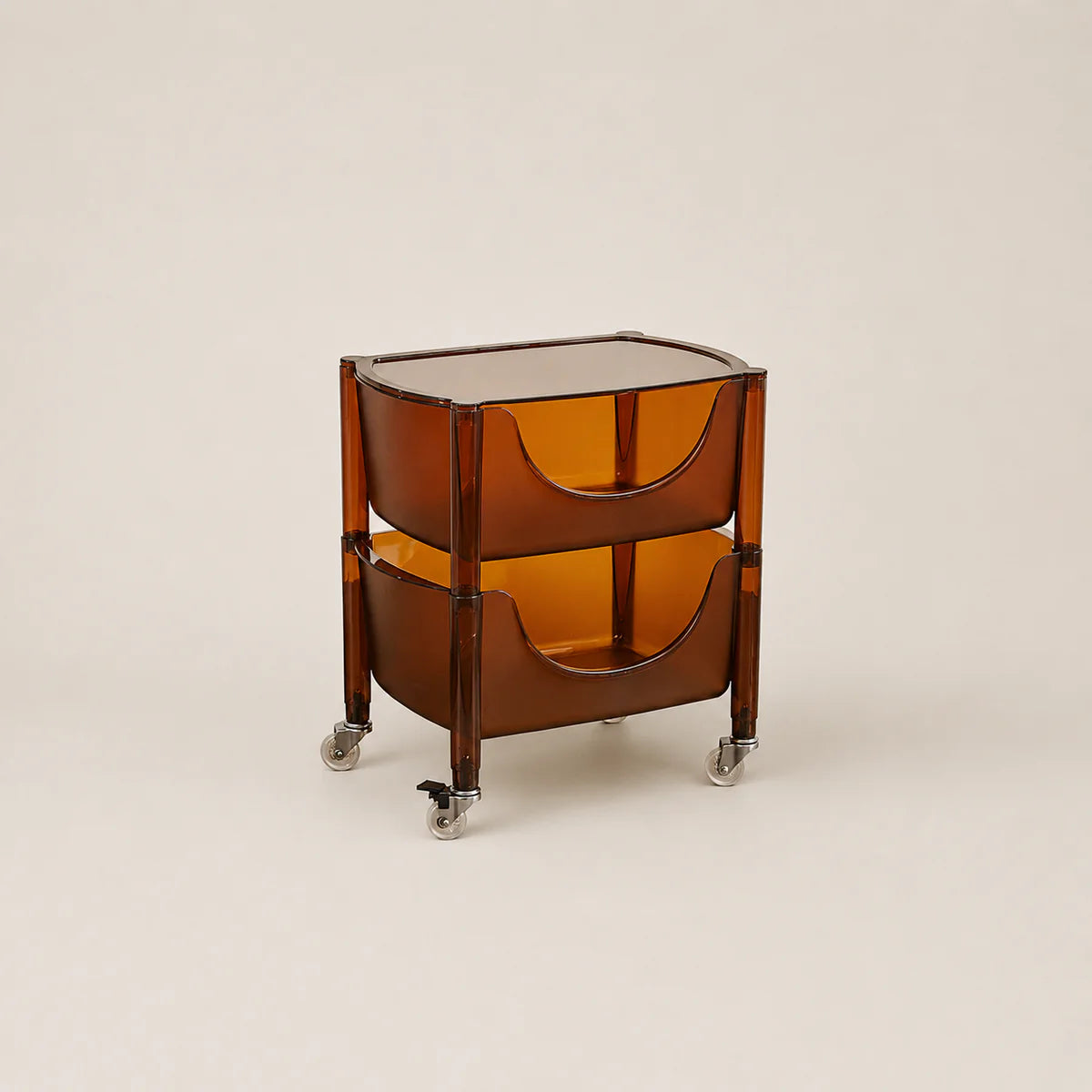 Transparent brown side table with wheels on a beige background