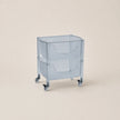 Clear plastic bin with wheels on a beige background