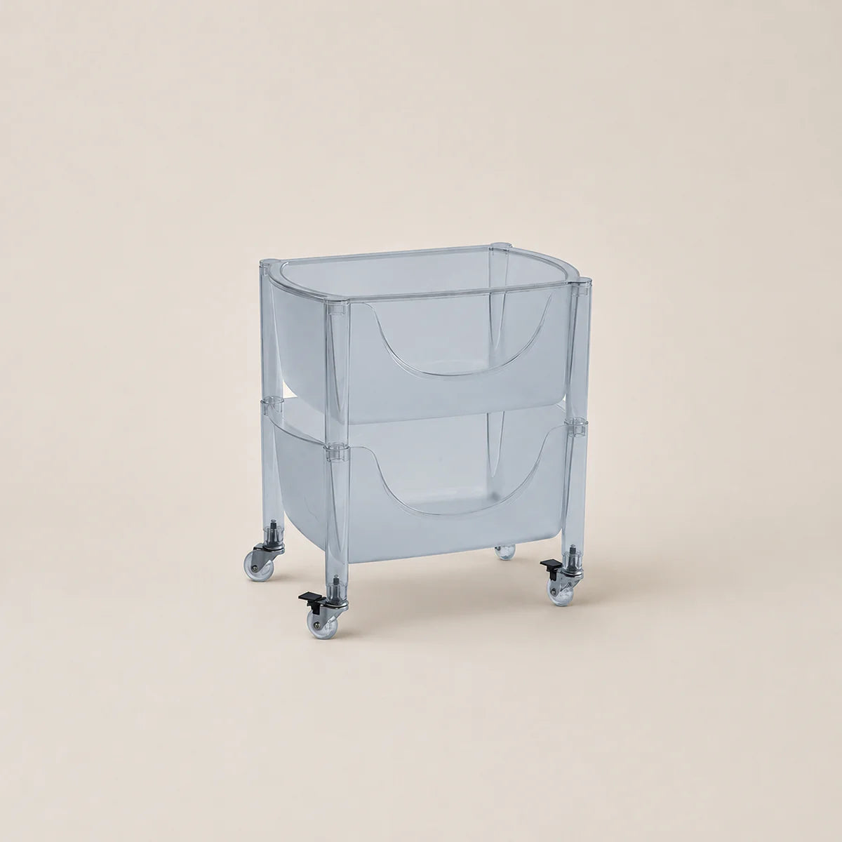 Clear plastic bin with wheels on a beige background