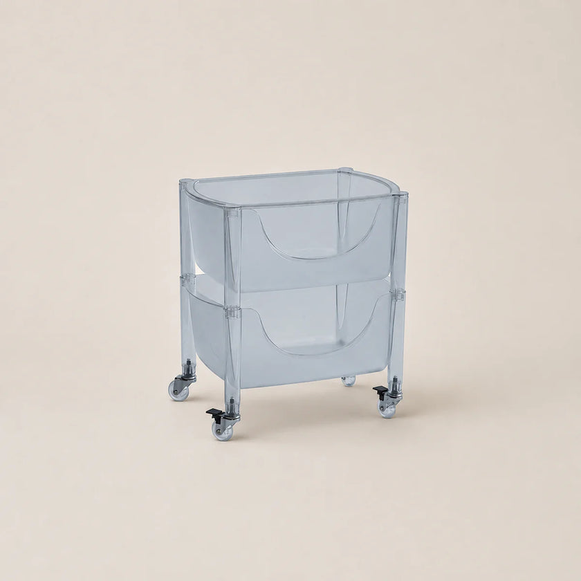 Clear plastic bin with wheels on a beige background