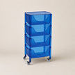 Blue rolling cart with transparent drawers on a beige background