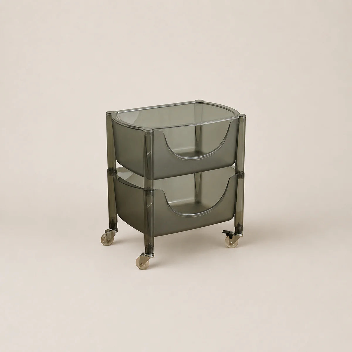 Glass serving cart on wheels with a beige background