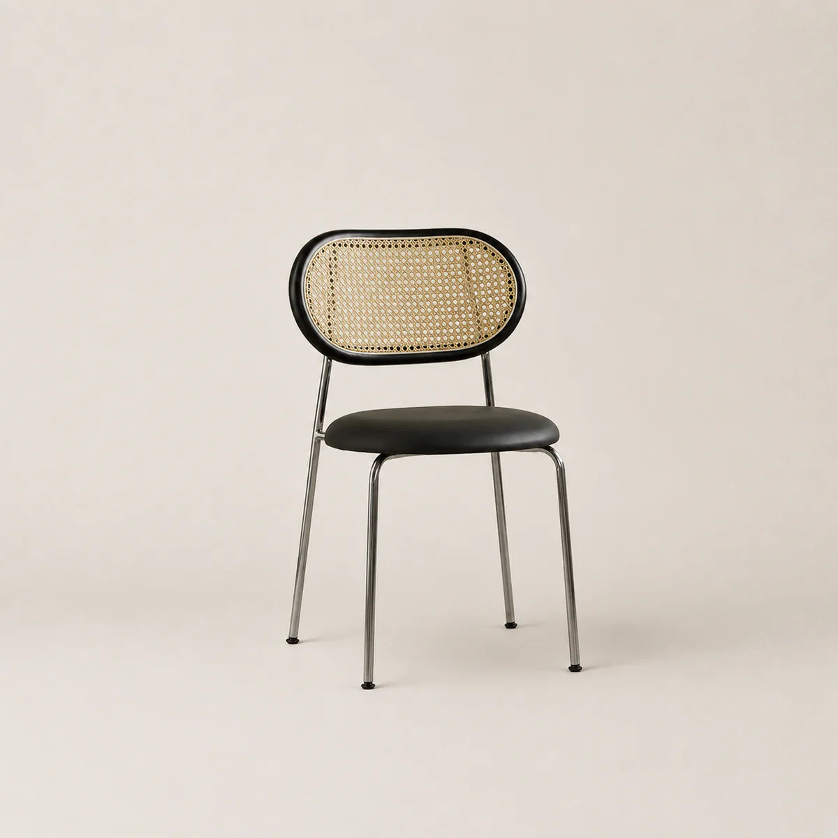 Chair with woven backrest and black seat on a beige background