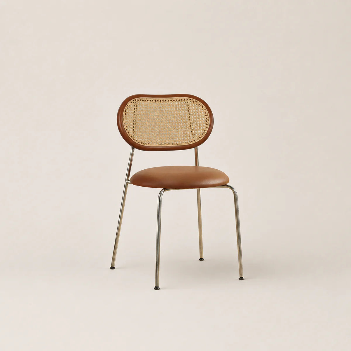 Chair with wicker backrest and brown seat on a beige background