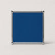 A square cobalt blue plaque or sign with a polished silver metal frame and corner brackets, shown against a plain light gray background.