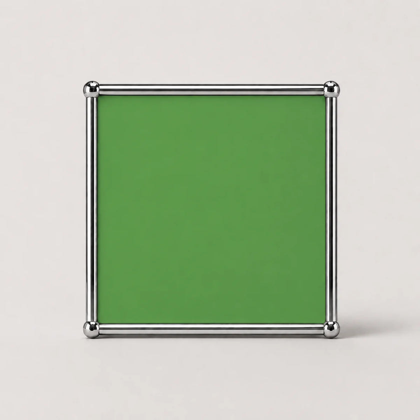 A 1.1mm green square panel accessory from the UF Nexus modular furniture series, surrounded by 304 stainless steel tubing and 8k polished chrome-plated brass connecting balls.