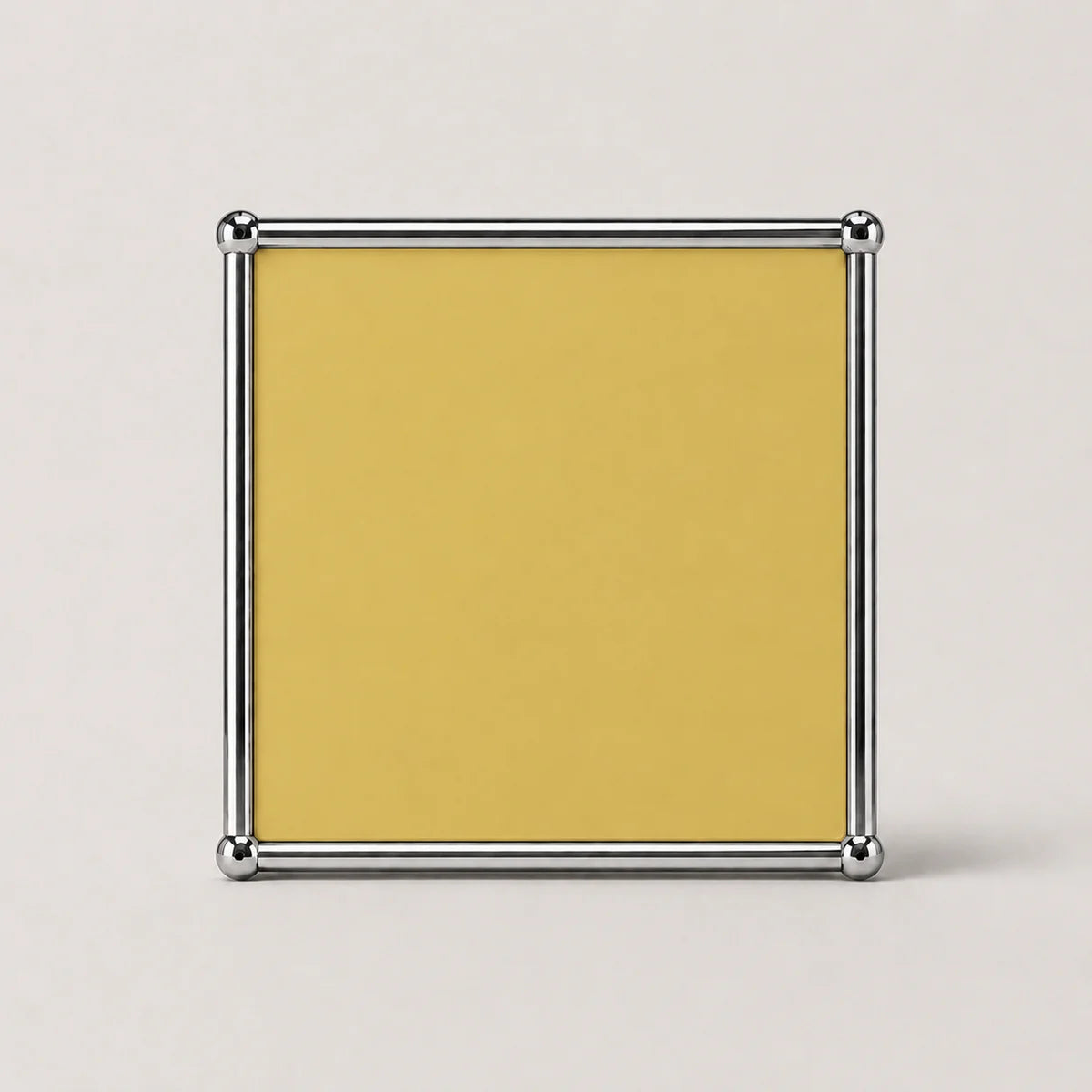 A square goose yellow card or insert with a polished silver metal frame, shown against a light gray background.