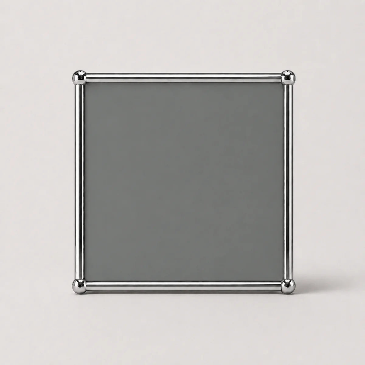 A square gray decorative frame with a polished silver metallic border and corner accents, displayed on a light gray background.