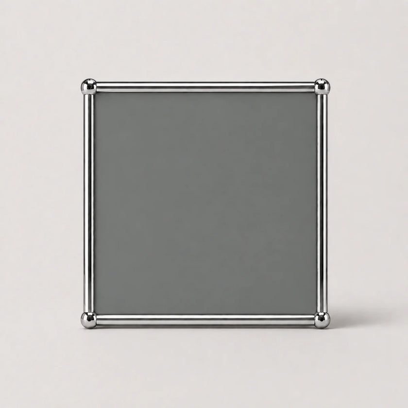 A square gray decorative frame with a polished silver metallic border and corner accents, displayed on a light gray background.