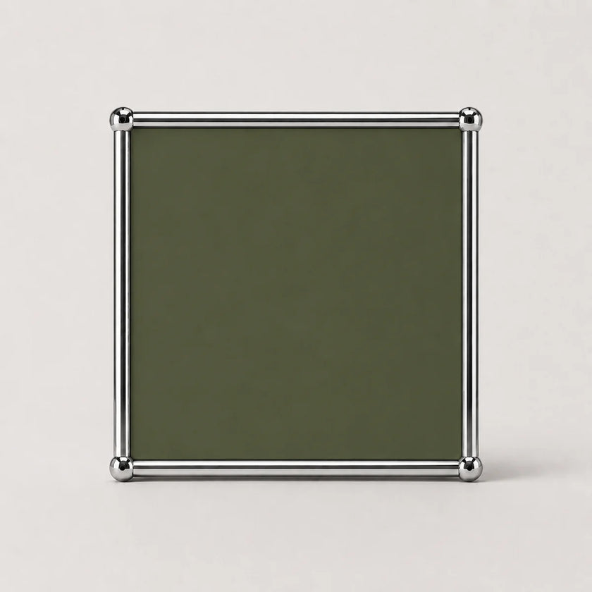 A square metal-framed picture frame with a dark olive green insert, shown against a light gray background.