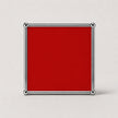 A square ruby red plaque or sign with a polished silver metal border and corner caps, shown against a neutral light gray background.