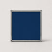 A square steel blue plaque or sign with a polished silver metal frame and corner protectors, shown against a light gray background.