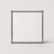 A white square metallic frame made of four polished silver rods with ball joints at each corner, standing upright on a light gray background.