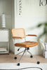 Brown office arm chair with woven backrest in a room setting.