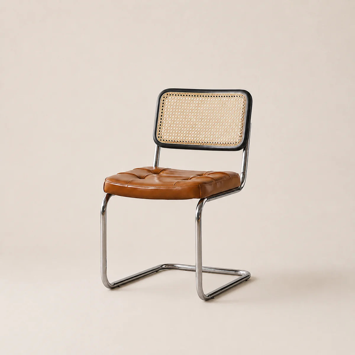 Chair with brown leather seat and wicker back on a beige background
