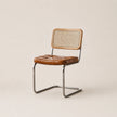 Brown chair with woven backrest on a beige background