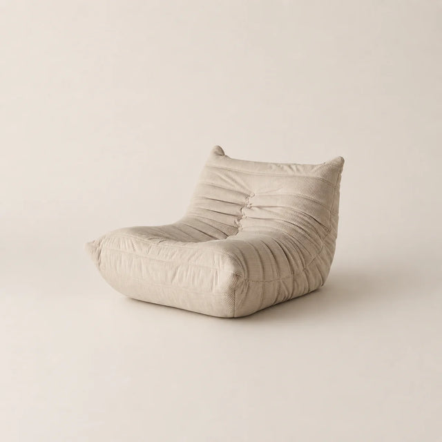 Beige bean bag chair on a beige background