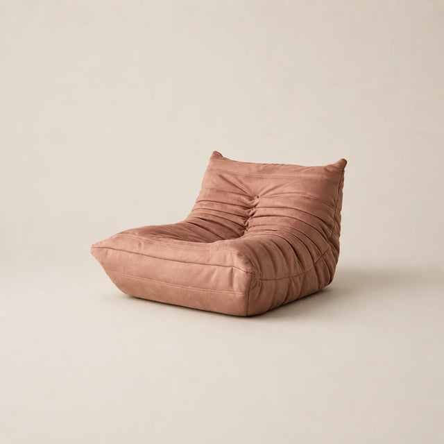 Pink bean bag chair on a beige background