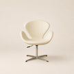 White swivel chair on a beige background