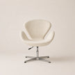 Beige swivel chair on a plain background