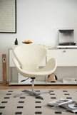 White leather swivel chair in a modern living room with a rug and books.