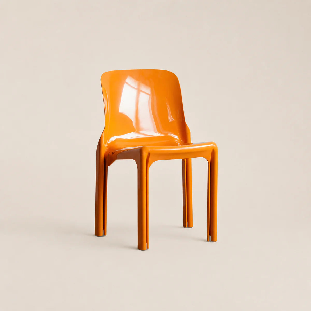 Orange chair on a beige background