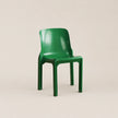 Green chair on a beige background