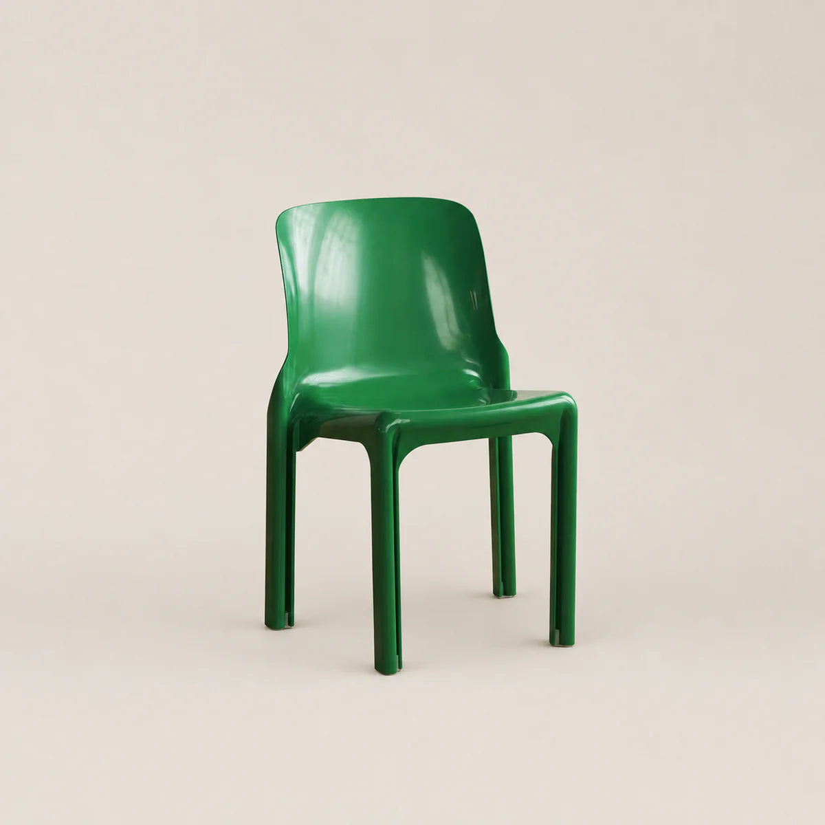 Green chair on a beige background
