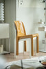 Modern plastic chair with a glossy finish in a room setting