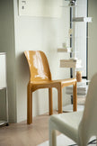 Plastic living room chair in a room with a shelf and window