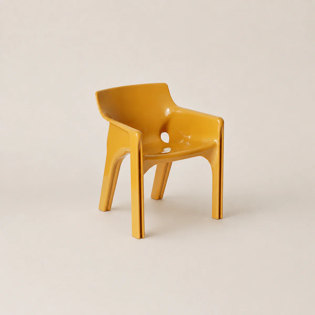 Yellow chair on a beige background