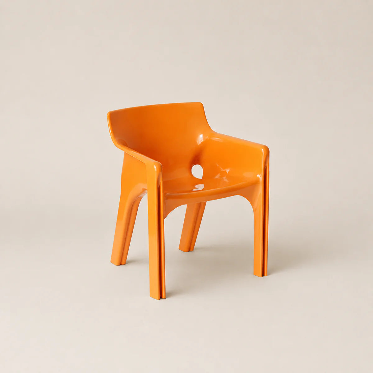 Orange chair on a beige background