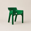 Green chair on a beige background