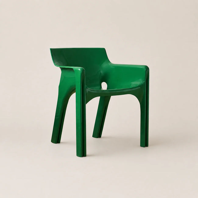 Green chair on a beige background