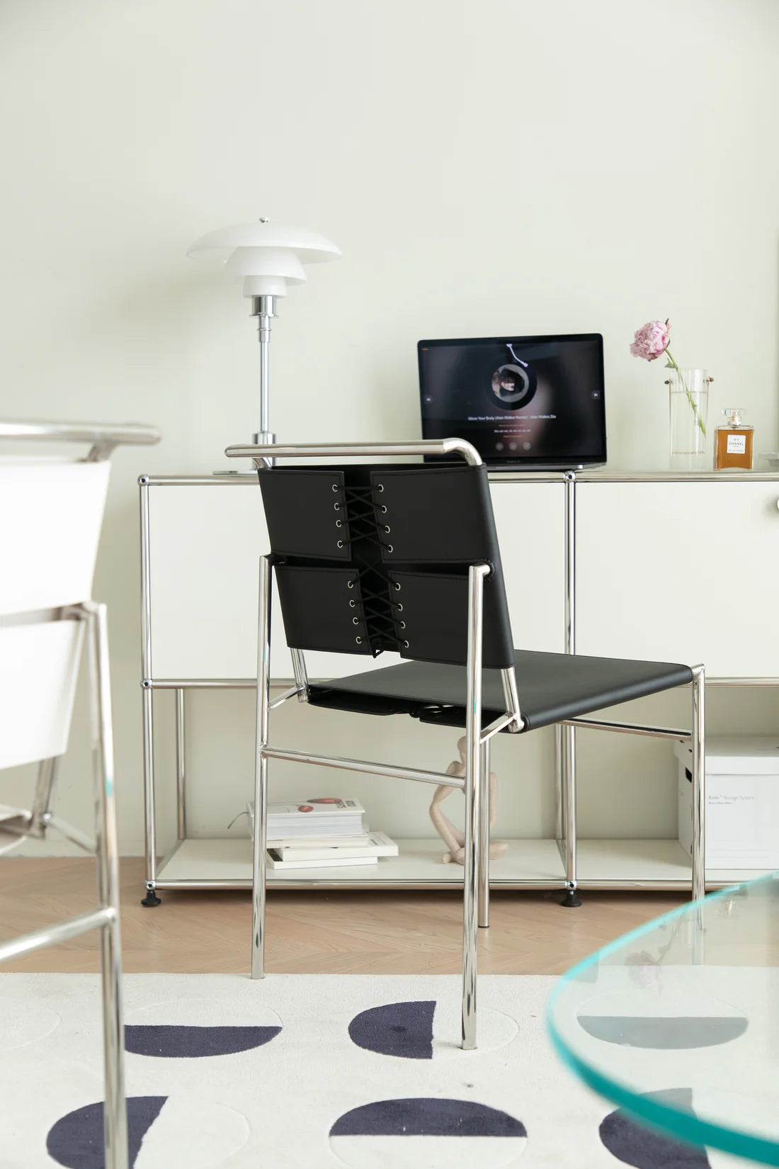 Modern office leather dining chair in a stylish office setting with a desk and computer monitor.