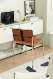 Modern office setup with a desk,  office chair, and decor elements.