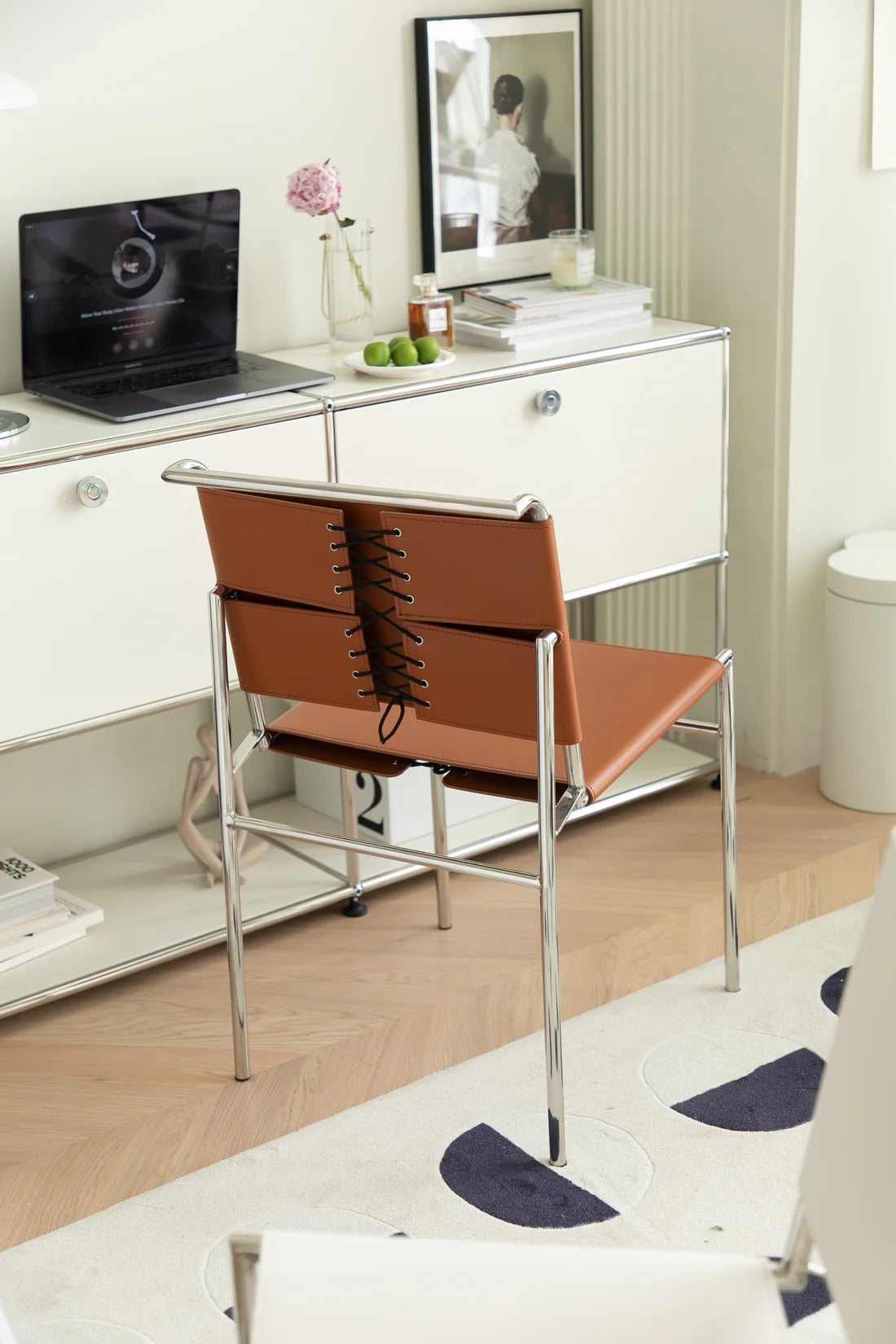 Modern office setup with a desk,  office chair, and decor elements.
