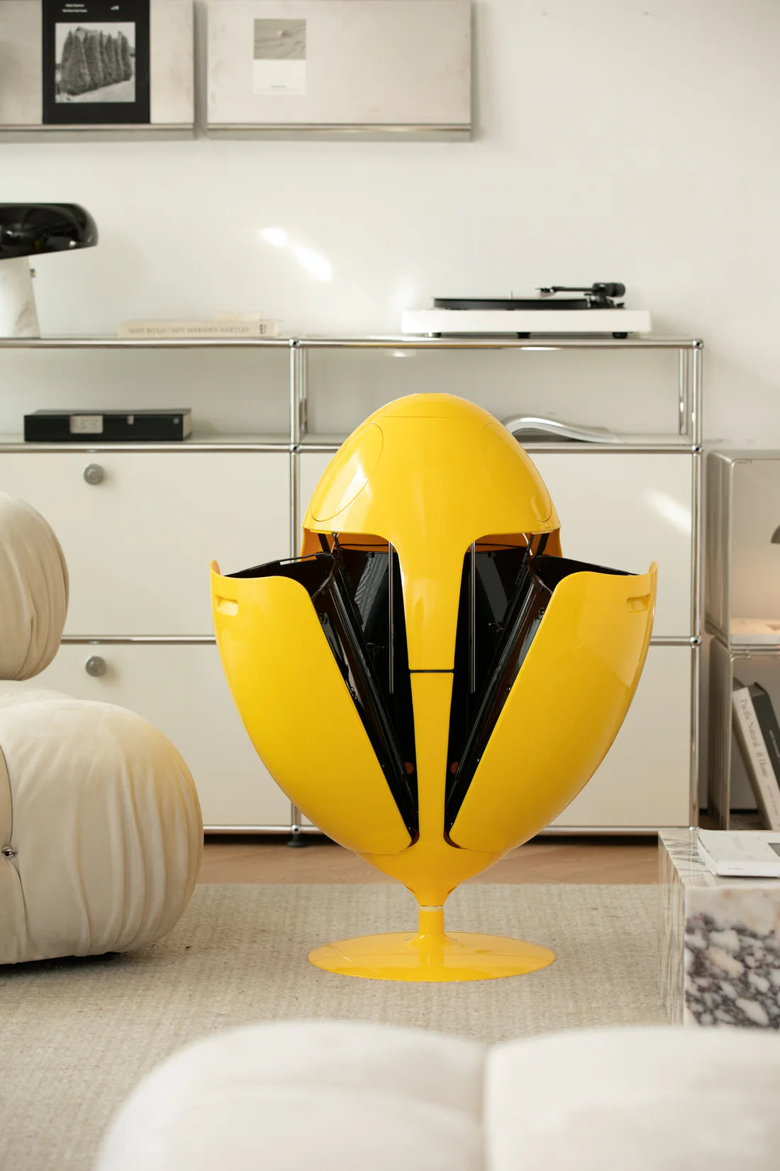 Yellow and black recycle bin in a modern living room setting