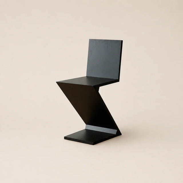 Modern black chair on a beige background